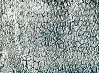 Abstract metal background with peeling and re-painted surface.