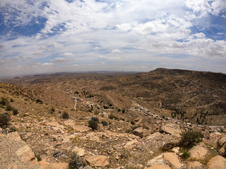 Valley in the mountains of Tunisia, stones and sands around
