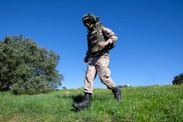 soldier in camouflage suit running