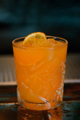 Grapefruit cocktail or Luce Del Sole cocktail at dark background. Closeup.