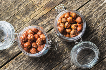 Hazelnuts with sugar icing in jar.