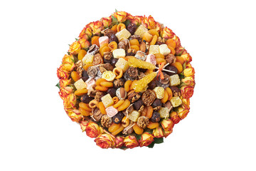 Composition in the form of a bouquet of orange and yellow dried fruits with nuts on a white background