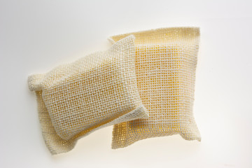 Turmeric with honey spa herbal soap net isolated on white background. Top view.