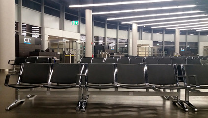 Empty airport. An empty waiting area at the airport near the departure gate. Photo of an empty...
