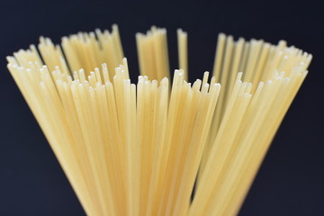 Italian long pasta, on dark background