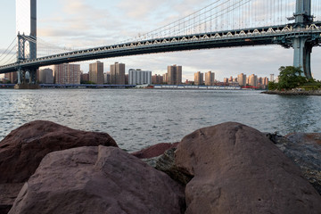 Manhattan bridge with rocks