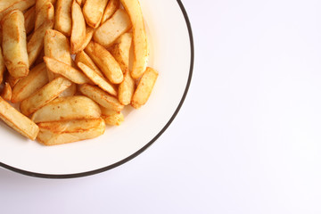 A studio photograph of cooked oven chips