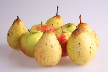A studio photograph of apples and pears against a white background