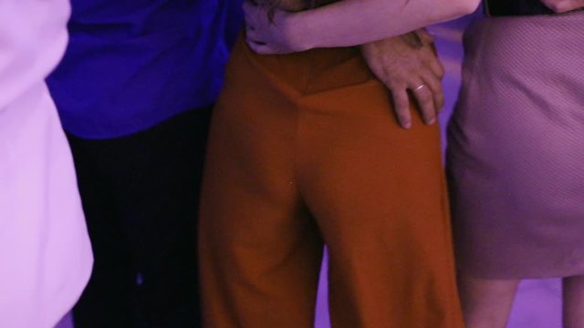 Dancing girls shake their hips, buttocks, have fun at a party.dancing at the party. close-up