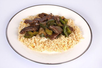 Chinese Cuisine, beef and black bean sauce with egg fried rice against a white background