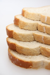 A studio photograph of 5 slices of white bread