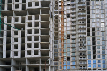 Construction site. High rise Building under construction. Construction of high-rise residential building