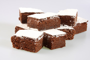 A studio photograph of chocolate brownies