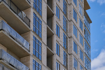 Obraz premium Construction site. High rise Building under construction. Construction of high-rise residential building