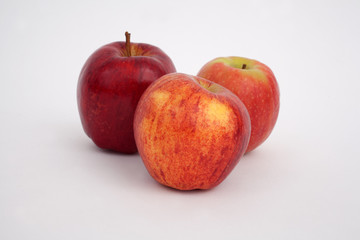 A studio photograph of apples against a white background