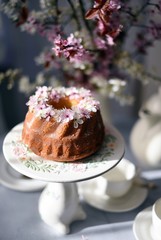 bundt cake.  Easter orthodox sweet bread with flowers.  Easter breakfast table setting. Decoration for Easter family celebration.