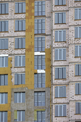 Obraz premium Construction site. High rise Building under construction. Construction of high-rise residential building