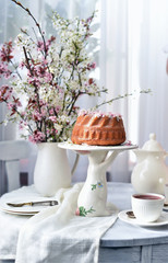 bundt cake.  Easter orthodox sweet bread with flowers.  Easter breakfast table setting. Decoration for Easter family celebration.