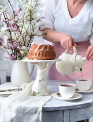 bundt cake.  Easter orthodox sweet bread with flowers.  Easter breakfast table setting. Decoration for Easter family celebration.