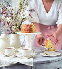 bundt cake.  Easter orthodox sweet bread with flowers.  Easter breakfast table setting. Decoration for Easter family celebration.