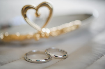 Two white golden wedding rings. Symbol for marriage, love, relationships, proposals, valentine's day
