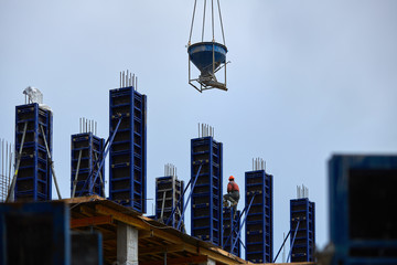 Pouring concrete on the construction of a high-rise building