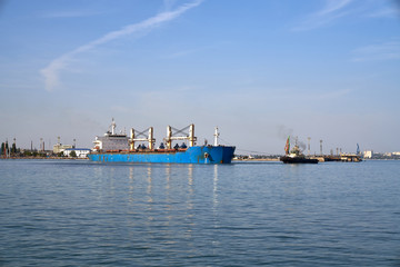 Fototapeta premium bulk carrier vessel is sailing in the port area.