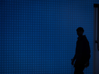 silhouette of a man on blue background