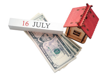 Money, home and calendar. The concept of financial independence and the scheduled start date for July 16