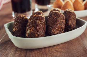 Brazilian appetiser kibbeh (Middle Eastern minced meat and bulghur fried snack)