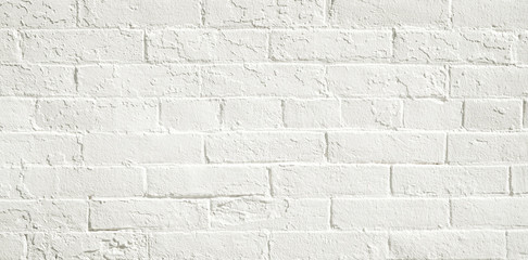 White brick wall background. Neutral texture of a flat brick wall close-up.