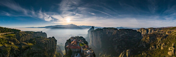Aerial view of monastery Trinity and breathtaking pictures of valley and landmark canyon of Meteora...