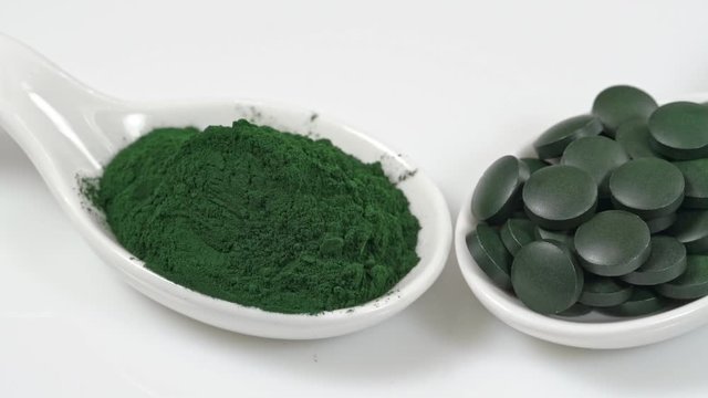 Super food vitamins and minerals in spirulina for vegetarians and a healthy life. On a white background close-up.