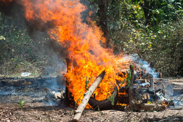 Cremate death people on fire flame burning, red and orange flame glowing, cremation ceremony concept, religion tradition of people, burning death people on hot bonfire
