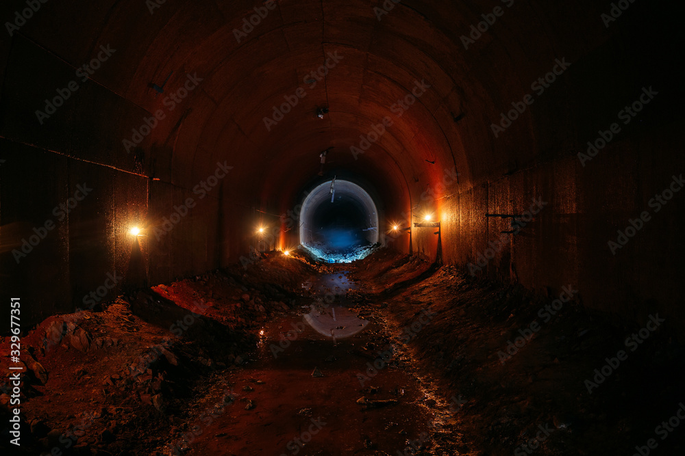 Wall mural Dark dirty flooded abandoned vaulted drainage tunnel - Wall murals
