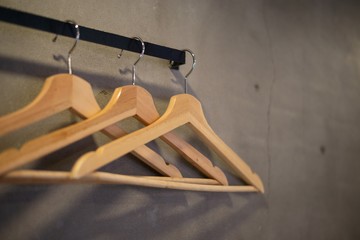 The hangers hanging on the wall.