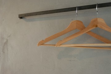The hangers hanging on the wall.