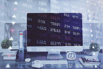 Forex graph hologram on table with computer background. Double exposure. Concept of financial markets.