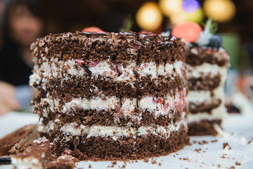 White cake with strawberries and blueberries. Dessert table for a party. Candy bar. White wedding cake