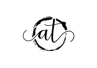 A and T Initial handwriting logo design with brush circle. handwritten logo for fashion, team, wedding, luxury logo.
