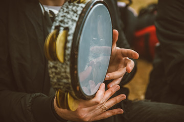 Traditional Instrument from Middle East and Asia called Def or Tef . A Musician Playing Note on drum Def