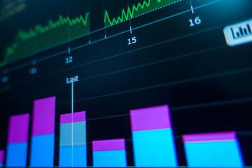 Stock market trading graph and candlestick chart on screen monitor for financial investment and...