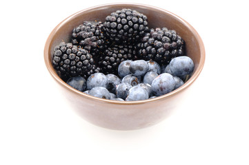 Blueberry and Blackberry on blown cup with white background, fruit concept