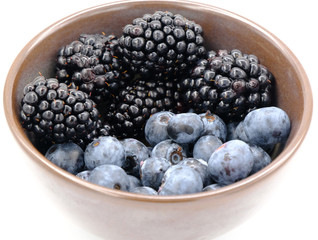 Blueberry and Blackberry on blown cup with white background, fruit concept