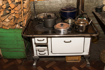 White wood stove with many holes on top, perfect for heating the house and making food, widely used in chile