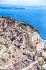 Traveling Concepts. View of Greek Architecture on Caldera Volcanic Slopes of Santorini Oia or Ia Village in Greece. With Traditional Pale Houses in Foregound.