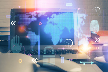 Obraz premium Multi exposure of table with computer and world map hologram. International data network concept.