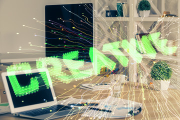 Desktop computer background in office and start up theme hologram drawing. Double exposure. Startup...