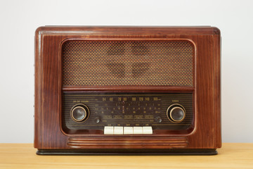 Vintage radio made of wood on a table