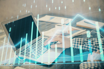 Obraz premium Double exposure of forex chart with man working on computer on background. Concept of market analysis.